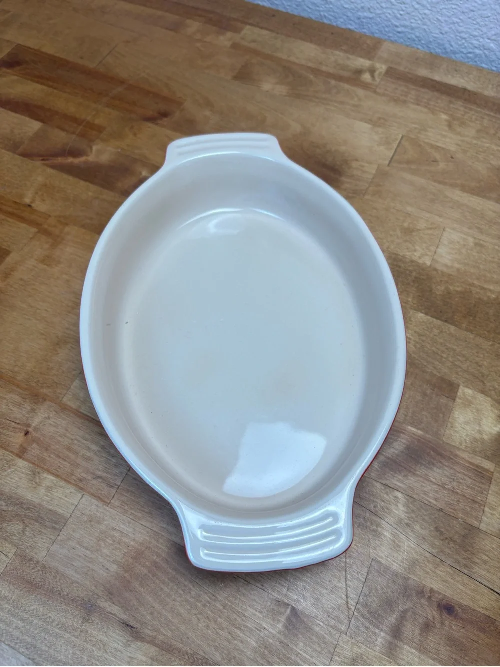 Le Creuset Red and Cream Oval Ceramic Baking Dish